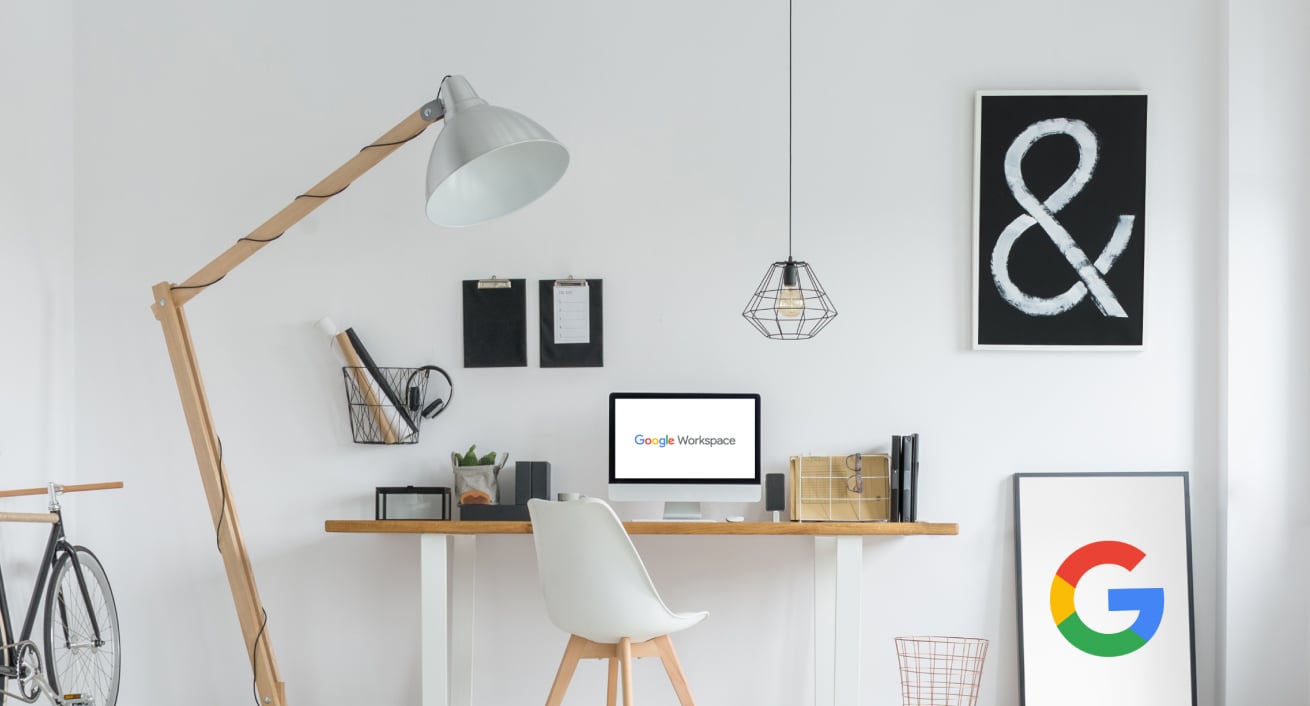 Google Workspace themed office space. White walls, light wood furniture and framed posters.  Used as banner image for BrainStorm, Inc. announcement of a partnership with Google (April 6, 2022)